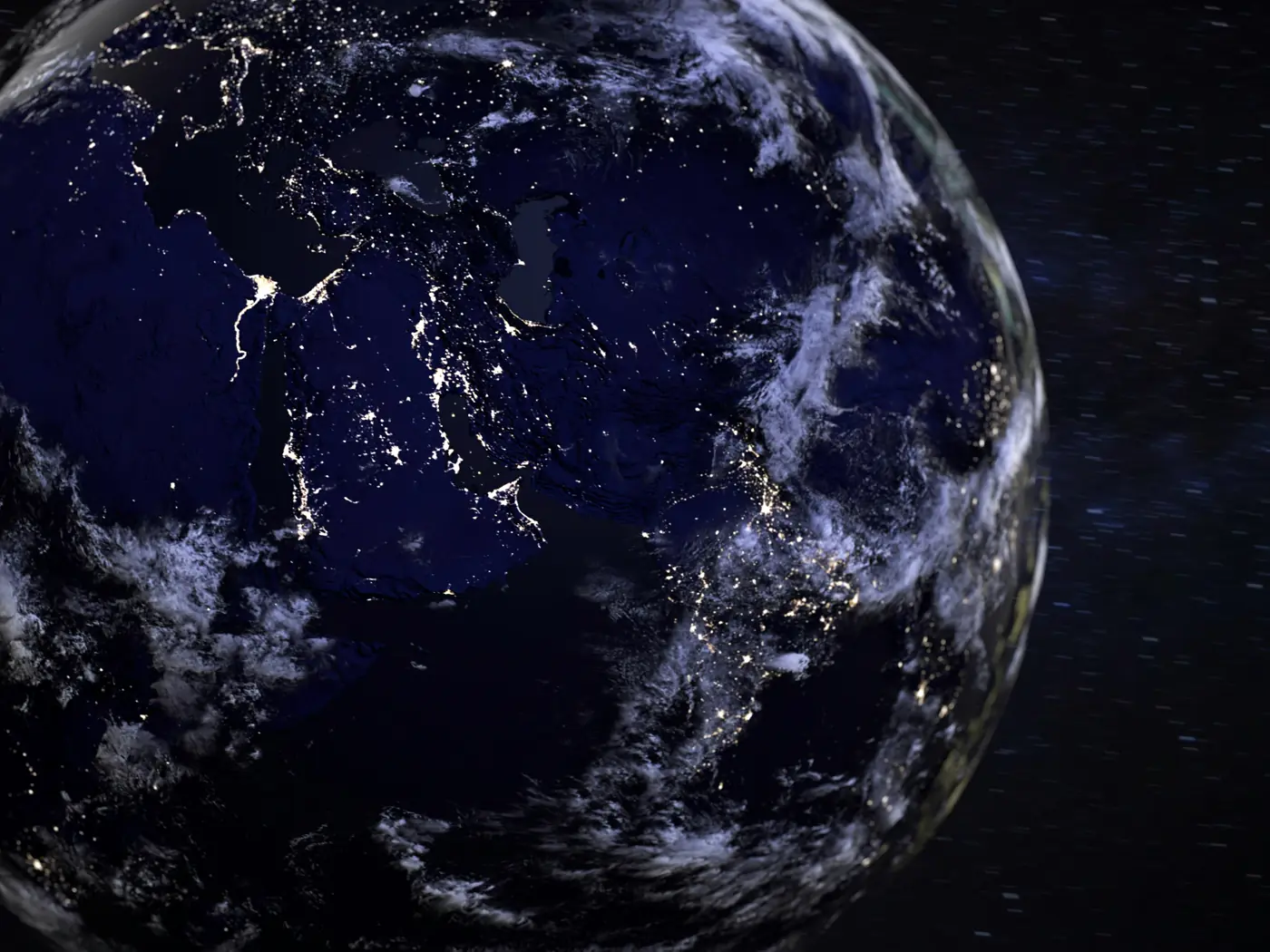 The Earth at night, cities lit across the dark side